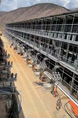 A bustling mining farm hosting various rigs, illustrating optimized environments for maximum ROI in cryptocurrency operations