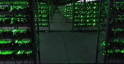 A bustling mining farm showcasing rows of high-efficiency miners ready for 2025 deployments